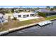 Aerial view of waterfront home with dock and backyard at 168 Morgan Se Ln, Port Charlotte, FL 33952
