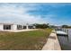Spacious backyard with patio, dock, and waterfront access at 168 Morgan Se Ln, Port Charlotte, FL 33952