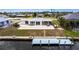 Beautiful waterfront home with a dock and patio perfect for outdoor entertaining and enjoying the water views at 168 Morgan Se Ln, Port Charlotte, FL 33952