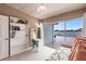 Bright bedroom features built-in shelving and a desk with scenic water views at 168 Morgan Se Ln, Port Charlotte, FL 33952