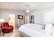 Comfortable bedroom with TV, ensuite bathroom, neutral decor, and wood ceiling at 168 Morgan Se Ln, Port Charlotte, FL 33952