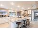 Bright kitchen boasts a large island with bar seating, ample cabinetry, and modern appliances at 168 Morgan Se Ln, Port Charlotte, FL 33952