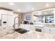 Kitchen featuring stainless steel appliances, ample counter space, and bright, white cabinets at 168 Morgan Se Ln, Port Charlotte, FL 33952