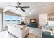 Inviting living room features waterfront views, comfortable seating, and a ceiling fan at 168 Morgan Se Ln, Port Charlotte, FL 33952