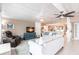 Spacious living room offers comfortable seating, blue accents, and natural light at 168 Morgan Se Ln, Port Charlotte, FL 33952