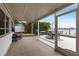 Spacious screened-in patio ideal for outdoor dining with tranquil water views at 168 Morgan Se Ln, Port Charlotte, FL 33952