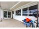 Spacious patio with white walls and beautiful backyard views. Great for storage at 168 Morgan Se Ln, Port Charlotte, FL 33952