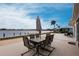 Outdoor patio with dining set overlooking a waterfront view at 168 Morgan Se Ln, Port Charlotte, FL 33952