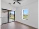 Bright bedroom with wood floors, ceiling fan, and lots of natural light at 17013 Alpenhorn Ct, Punta Gorda, FL 33955
