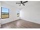 Bright bedroom with large windows offering an external view and a modern ceiling fan at 17013 Alpenhorn Ct, Punta Gorda, FL 33955