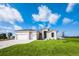 Stunning single-story home with a manicured lawn and a three-car garage, perfect for modern living at 17013 Alpenhorn Ct, Punta Gorda, FL 33955