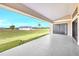 Expansive covered patio overlooking the manicured lawn and green spaces at 17013 Alpenhorn Ct, Punta Gorda, FL 33955