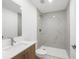 Modern bathroom with sleek vanity and walk-in shower with marble tile surround at 17261 Naiad Ct, Punta Gorda, FL 33955