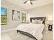 A peaceful bedroom boasts bright windows, soft lighting, and chic decor at 17261 Naiad Ct, Punta Gorda, FL 33955