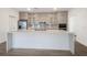 Modern kitchen features a large island, stainless steel appliances, and sleek cabinets at 17261 Naiad Ct, Punta Gorda, FL 33955