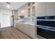 Modern kitchen featuring sleek cabinetry, stainless steel appliances, and a stylish backsplash at 17261 Naiad Ct, Punta Gorda, FL 33955