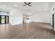 Open concept living area with modern tile flooring that flows into the kitchen at 17261 Naiad Ct, Punta Gorda, FL 33955