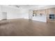 Bright, open-concept living space connected to modern kitchen with sleek cabinets at 17261 Naiad Ct, Punta Gorda, FL 33955