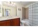 Bathroom featuring a single vanity with solid surface counters and shower-tub combo at 17288 Acapulco Rd # 411, Punta Gorda, FL 33955