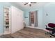 Charming bedroom with stylish built-in Murphy bed, coastal decor and window with wood blinds at 17288 Acapulco Rd # 411, Punta Gorda, FL 33955