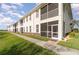 Exterior view of the rear of this two-story condominium with private screened lanais at 17288 Acapulco Rd # 411, Punta Gorda, FL 33955