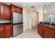 Modern kitchen featuring stainless steel appliances, granite countertops, and ample storage at 17288 Acapulco Rd # 411, Punta Gorda, FL 33955