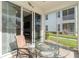 Screened lanai offers a glimpse into the living room with fireplace and the outdoors at 17288 Acapulco Rd # 411, Punta Gorda, FL 33955