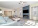 Spacious and inviting living area with fireplace, seamlessly connected to dining and kitchen areas at 17288 Acapulco Rd # 411, Punta Gorda, FL 33955