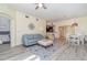 Open-concept living and dining area featuring updated flooring, a fireplace, and seamless flow for entertaining at 17288 Acapulco Rd # 411, Punta Gorda, FL 33955
