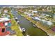 An aerial view shows the property's location on a canal with boat access and neighborhood at 1756 Boca Raton Ct, Punta Gorda, FL 33950