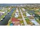 Aerial view showcases a waterfront property with a dock and easy access to the waterway at 1756 Boca Raton Ct, Punta Gorda, FL 33950