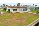 Home with a well manicured lawn and waterfront views from the backyard at 1756 Boca Raton Ct, Punta Gorda, FL 33950