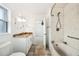Bathroom with marble tile shower, tub, and vanity with granite countertops at 1756 Boca Raton Ct, Punta Gorda, FL 33950