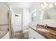 Bright bathroom featuring a granite vanity, tile shower, and tub at 1756 Boca Raton Ct, Punta Gorda, FL 33950