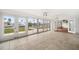 Bright tiled sunroom boasts expansive views of the canal at 1756 Boca Raton Ct, Punta Gorda, FL 33950