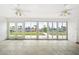 Sunroom with tiled floors and expansive sliding glass doors showcasing a water view at 1756 Boca Raton Ct, Punta Gorda, FL 33950