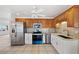 Updated kitchen with stainless steel appliances, granite countertops, and oak cabinets at 1756 Boca Raton Ct, Punta Gorda, FL 33950