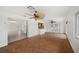 Bright living room with unique tile flooring, ceiling fans, and natural light at 1756 Boca Raton Ct, Punta Gorda, FL 33950