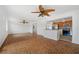 Bright living room featuring unique tile flooring open to the kitchen at 1756 Boca Raton Ct, Punta Gorda, FL 33950