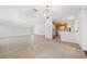 Open living room featuring tile floors, stylish lighting, and access to the kitchen at 1756 Boca Raton Ct, Punta Gorda, FL 33950