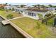 A well kept backyard with a dock located along a canal for outdoor enjoyment at 1756 Boca Raton Ct, Punta Gorda, FL 33950