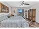 Bedroom featuring hardwood flooring, a sunny window and a painted landscape art piece at 1849 E Isles Rd, Port Charlotte, FL 33953