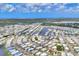 Wide aerial view of the neighborhood showing ponds and canals throughout the community at 215 Schooner St, North Port, FL 34287