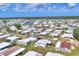 An aerial view shows the community and homes available with many ponds and canals throughout at 215 Schooner St, North Port, FL 34287