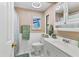 Cozy bathroom featuring a white sink, toilet and shower/tub combination at 215 Schooner St, North Port, FL 34287