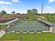 Aerial view of the bocce ball courts including benches and lush surrounding landscape at 215 Schooner St, North Port, FL 34287