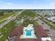 Aerial of clubhouse showing unique pool layout, jacuzzi and lounging area at 215 Schooner St, North Port, FL 34287