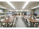 Bright dining area featuring ample table seating, a pool table, and kitchenette for hosting events at 215 Schooner St, North Port, FL 34287