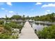 Well-maintained dock extending into calm water, ideal for mooring boats and recreational water activities at 215 Schooner St, North Port, FL 34287