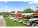 Multi-colored Kayaks are neatly stored offering watersport adventures for this community at 215 Schooner St, North Port, FL 34287